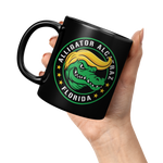 Alligator_Alcatraz_Gator_Trump_Hair_Blac_11oz_Black_LH_Model_Mockup.png