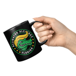 Alligator_Alcatraz_Gator_Trump_Hair_Blac_11oz_Black_RH_Model_Mockup.png