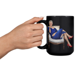 Funny_Bill_Clinton_in_Blue_Dress_Coffee__15oz_Black_LH_Model_Mockup.png