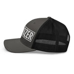 Black and gray trucker hat with 'OZER' embroidered in white, featuring mesh back and flat brim.