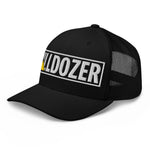 Black trucker hat with bold 'BULLDOZER' embroidery, white outline, yellow accent, mesh back