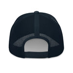 Back view of a navy blue mesh trucker hat with adjustable snapback closure
